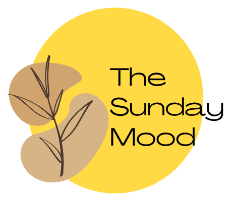 The Sunday Mood logo with a yellow circle, earthy accents, and a botanical design, representing a cozy and aesthetic lifestyle brand..